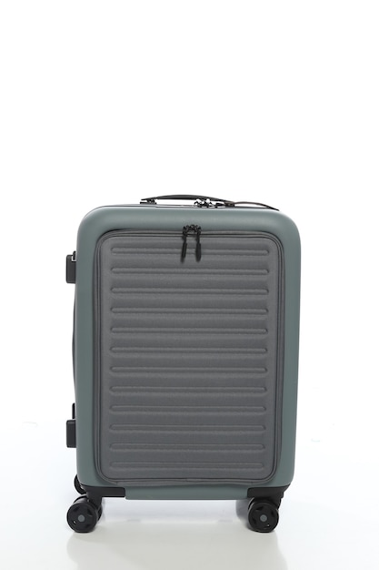 Green suitcase on white background