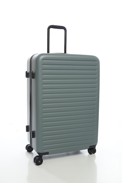 Green suitcase on white background