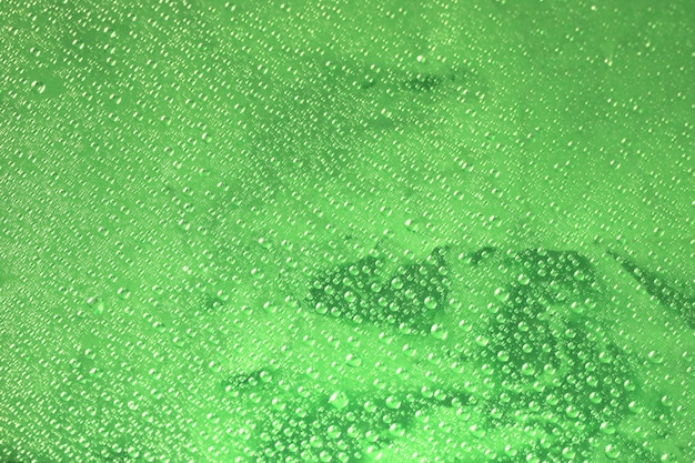 Green surface and water drops