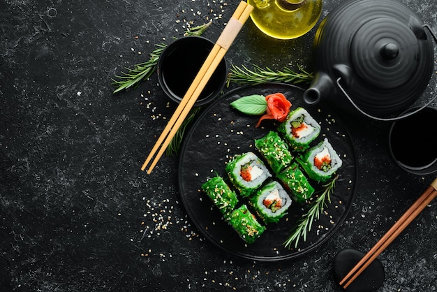 Green sushi japanese sushi with chuka salad asian diet food top
view