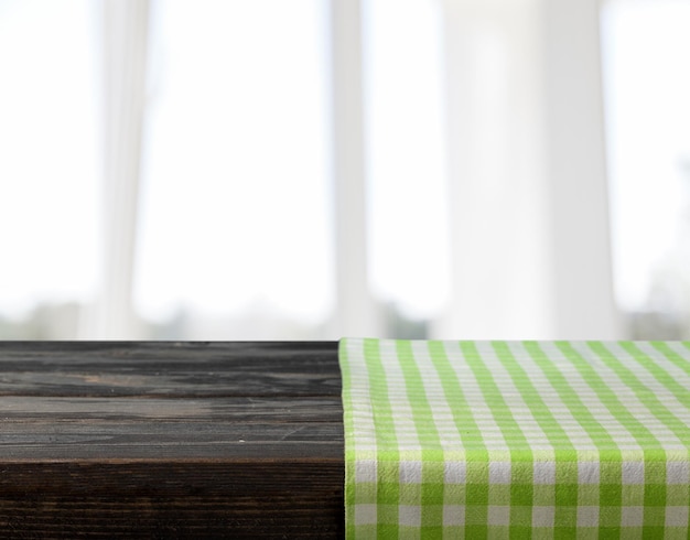 Green table cloth texture on desk