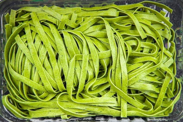 green tagliatelle raw pasta basil second course vegetable food healthy meal food snack