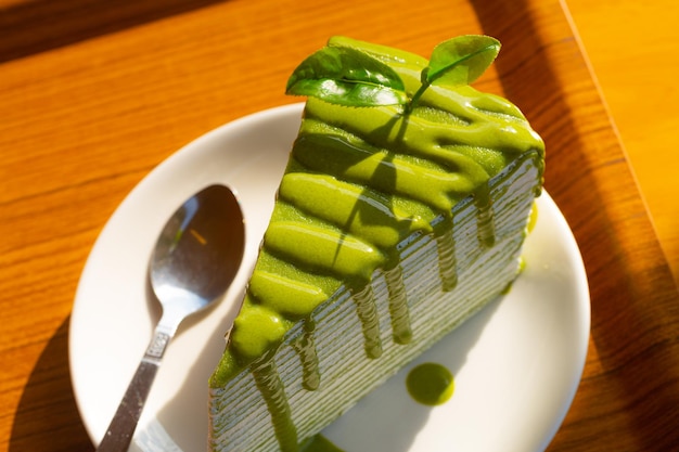 Green tea cheese cake dessert on white dish