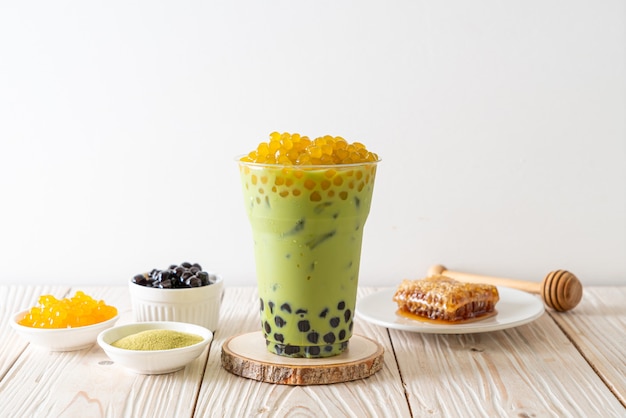 green tea latte with bubble and honey bubbles