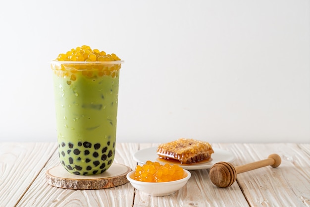 green tea latte with bubble and honey bubbles