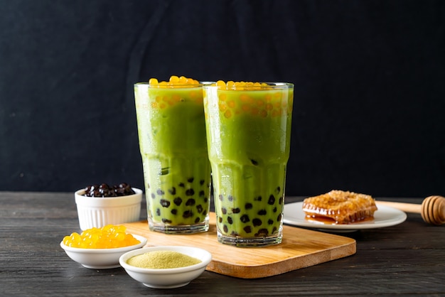 green tea latte with bubble and honey bubbles