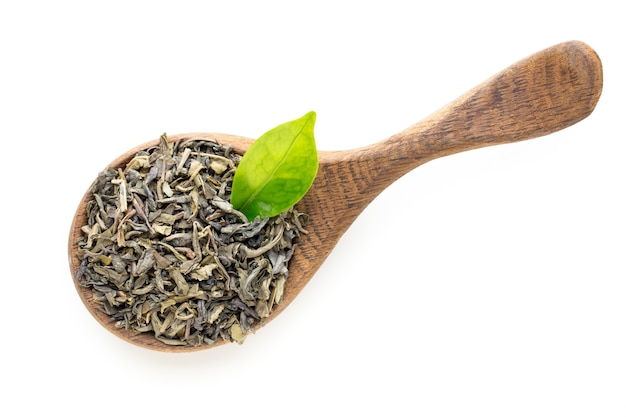 Green tea leaf the spoon isolated on white background.