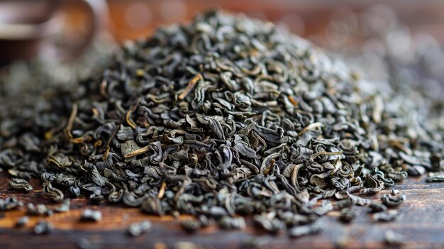 Photo green tea leaves on a wooden table