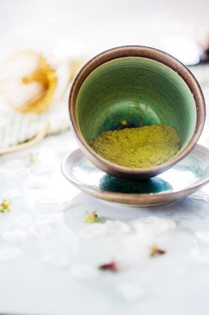 Green tea matcha in a bowl on table