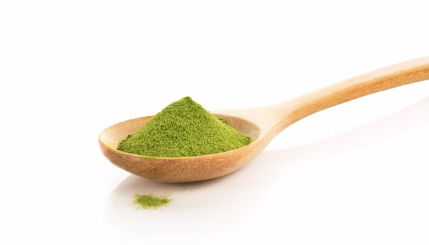 Green Tea Powder In Spoon Isolated On White Background