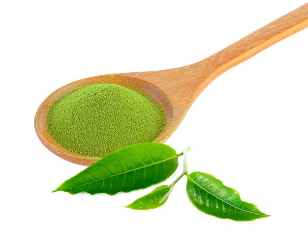 Green tea powder in a wooden spoon