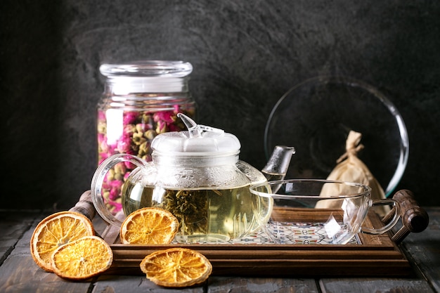 Green tea served in glass tea pot