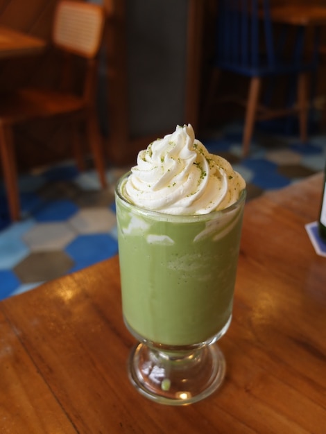 green tea whip cream wooden table