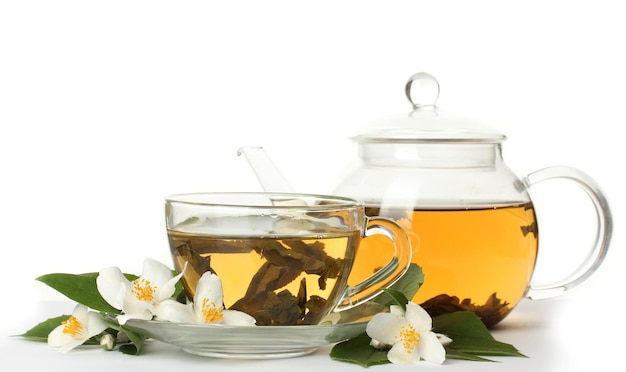 Green tea with jasmine in cup and teapot isolated on white