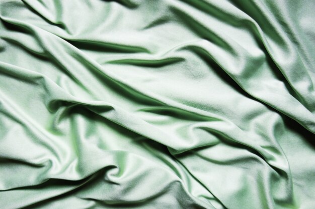 Photo green textile abstract background. close up
