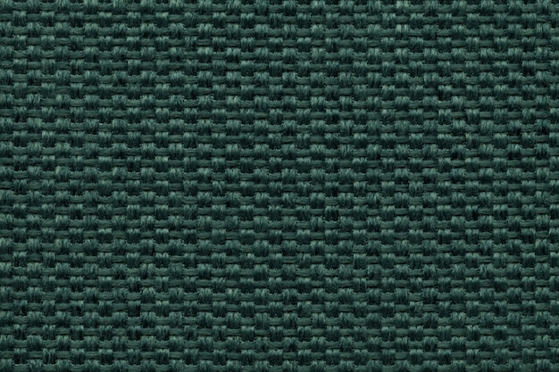 Green textile background with checkered patterno.