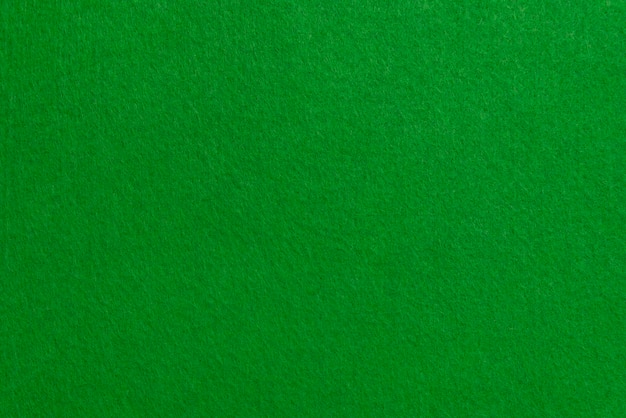 Green texture velour or suede cloth closeup Natural or artificial sewing material Fabric as background for design