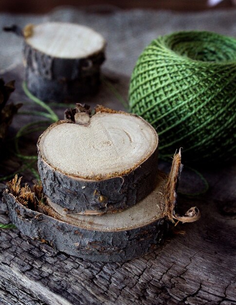 Green thread on wood firewood