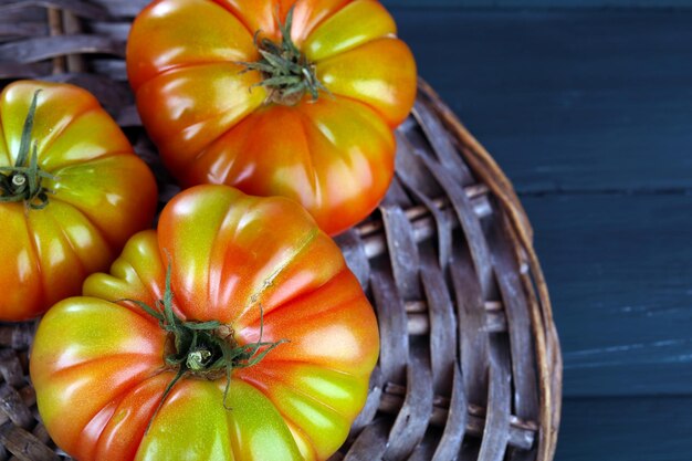 Green tomatoes on table close up