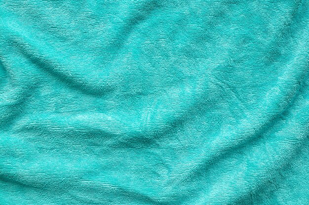 Green towel fabric texture surface close up background