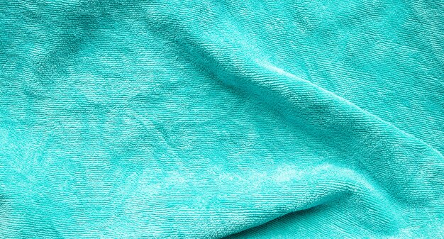 Green towel fabric texture surface close up background