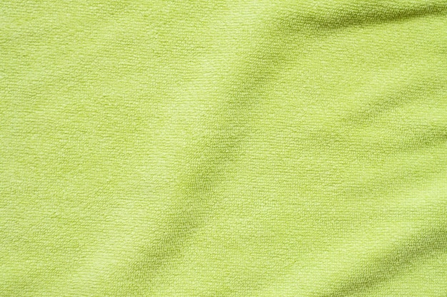 Green towel fabric texture surface close up background