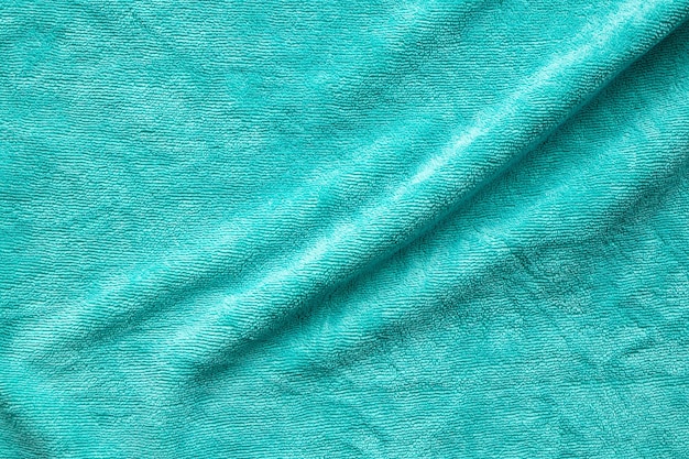 Green towel fabric texture surface close up background