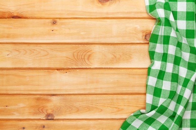 Green towel over wooden kitchen table