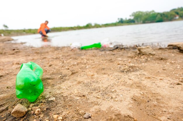 Green toy on beach