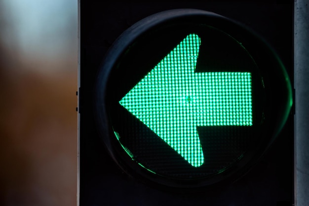 Green traffic light with green arrow light up Turn left