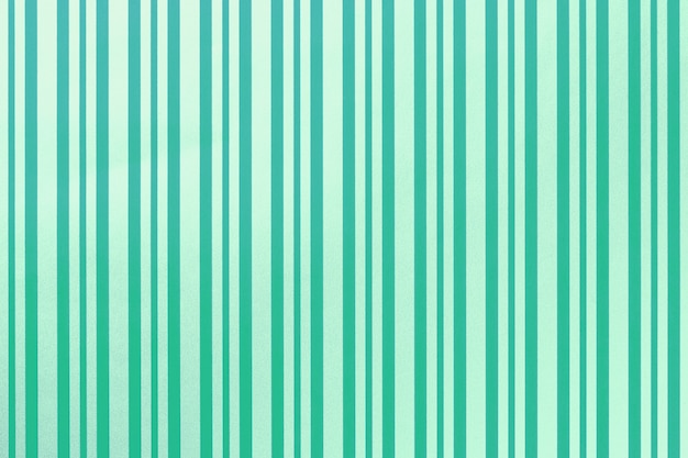 縞模様の紙の包装から緑とターコイズブルーの背景。