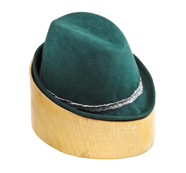 Green tyrolean felt hat on linden wooden block