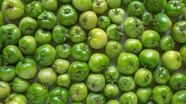 Green unripe tomatoes. Top view.