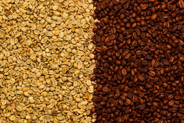 Green unroasted coffee beans and brown roasted coffee beans background