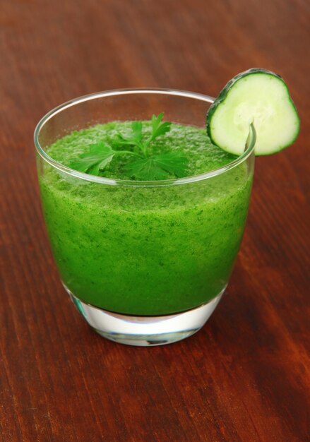 Green vegetable juice on table close-up