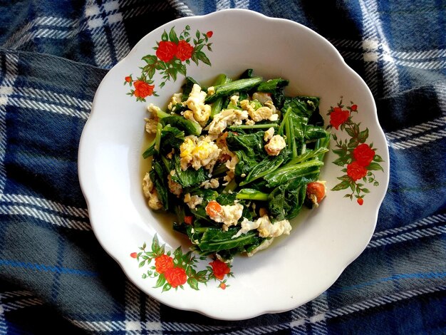 green vegetables with eggs on a plate Indonesian culinary food