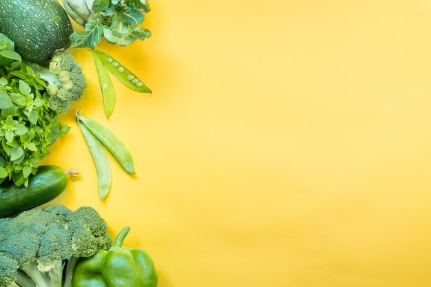 Green vegetables on yellow table