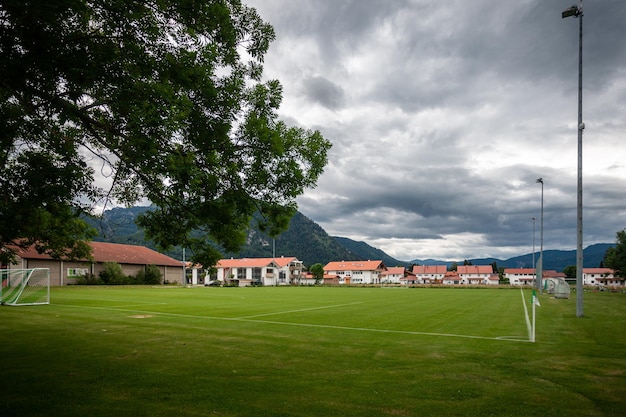 Green village football field in summer