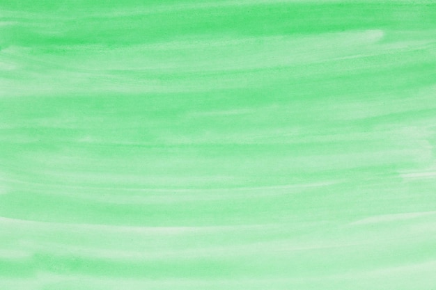 Green watercolor background hand painted by brush