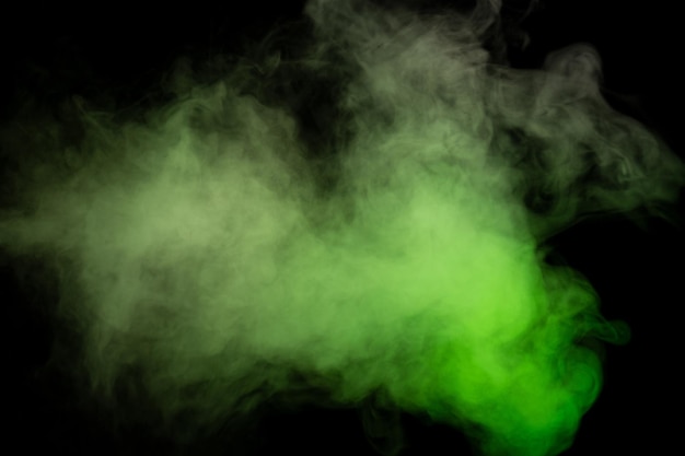 Green and white steam on a black background