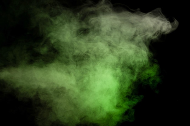 Green and white steam on a black background