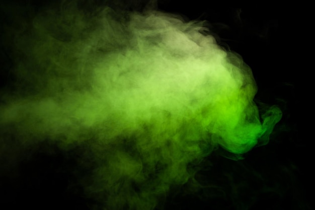 Green and white steam on a black background