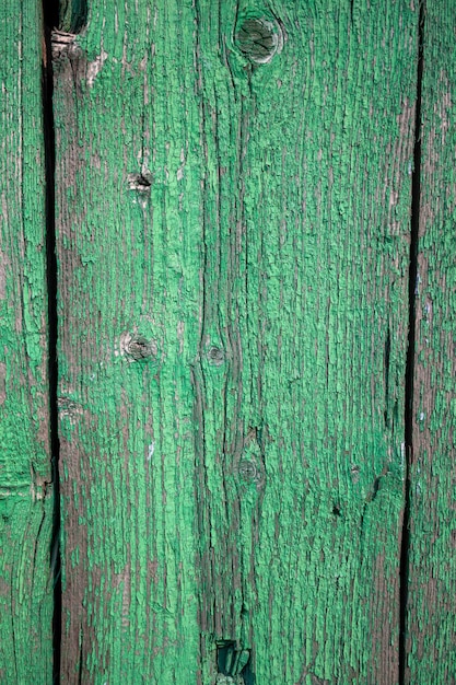A green wood wall with a red stripe