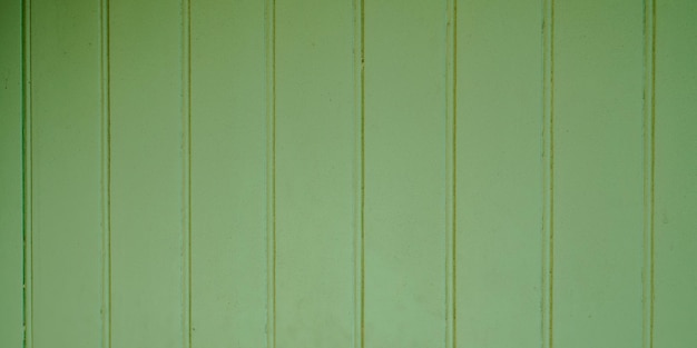 Photo green wooden boards with texture as background and wallpaper in web header panorama