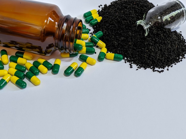 Green yellow capsule and black seeds on isolated background