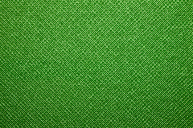 Green yoga mat texture background.