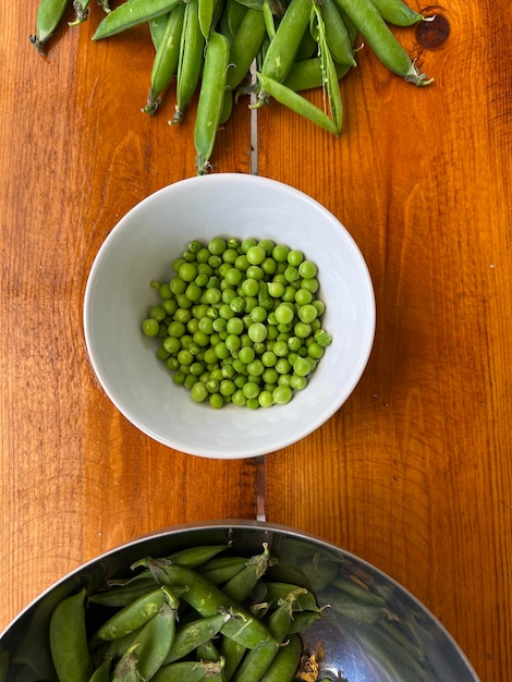 Green young sweet peas in a plate vegetable