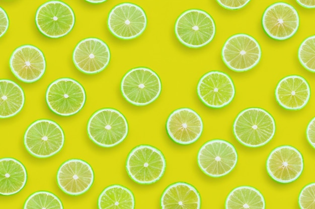 Greenlimeslicespatternonvibrantyellowcolorbackground