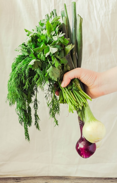 Greens in a woman hand