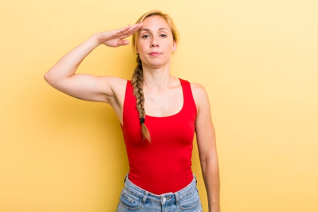 Photo greeting the camera with a military salute in an act of honor and patriotism showing respect